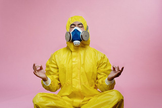Man In Yellow Safety Suit With Mask Eyes Closed