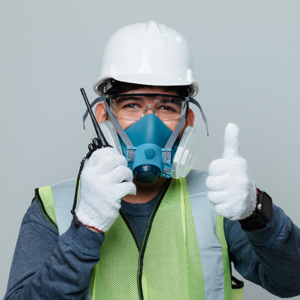 Man wearing respirator with thumbs up